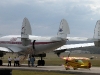 My Pitts taxiing under the shadow of the HARS Super Constellation at Nowra
