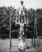 On a swing in our back garden in Batley, Yorkshire. That's me on top.